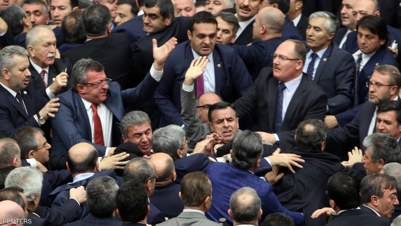 Lawmakers from ruling AK Party and the main opposition Republican People’s Party scuffle during a debate on the proposed constitutional changes at the Turkish Parliament in Ankara