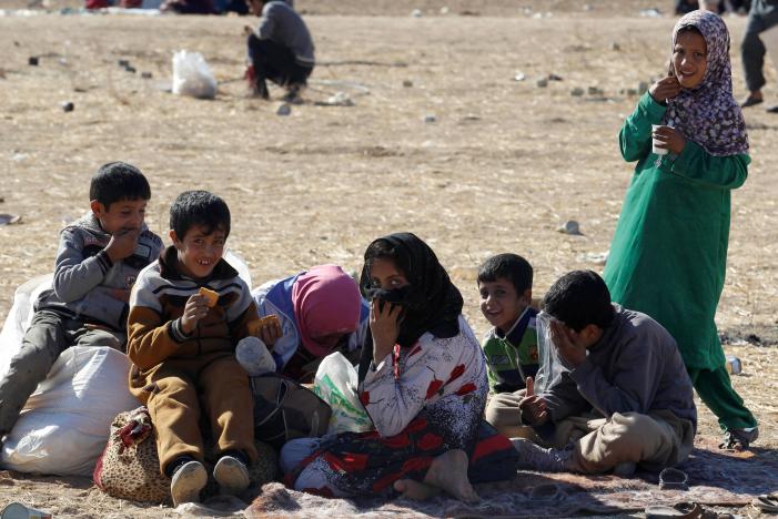 Displaced people from the outskirts of Mosul arrive in the town of Bashiqa, after it was recaptured from the Islamic State, east of Mosul